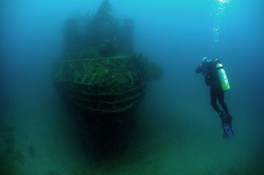 A diver and a sunken ship off the coast of Venezuela